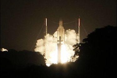 F/An Ariane 5 rocket blasts off, 21 December 2007 in Kourou, French Guiana. This 180th launch put into orbit a RASCOM-QAF1 telecommunications satellite for Africa, and a HORIZONS-2 IP and video transmission satellite for the USA, the Caribbean and Canada. AFP PHOTO JODY AMIET