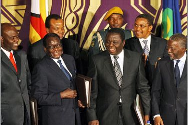 AFPFromL) Zimbabwe's new Deputy Prime Minister Arthur Mutambara, Zimbabwe President Robert Mugabe, new Prime Minister Morgan