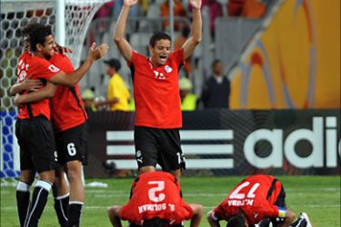 Egyptian under-20 team's football players celebrate their 4-1 victory over Trinidad and Tobago after the end of the opening game of the FIFA under-20 World Cup at the stadium