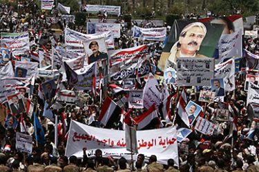 Supporters of Yemeni President Ali Abdullah Saleh gather in Sanaa's Tahrir Square on April 1, 2011 during a rally to show their support, as a massive security operation kept huge rival protests apart and split the Yemeni capital on another Friday political showdown on the streets between the president's backers and his foes