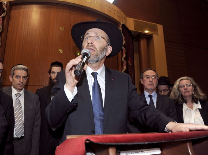 The Great Rabbin of France Gilles Bernheim gives a speech, on March 19, 2012, during a ceremony at the Grand synagogue in Toulouse, southwestern France, after the today's shooting of the "Ozar Hatorah" Jewish school inToulouse. Four people (three of them children), were killed and one seriously wounded when a gunman opened fire. This is the third gun attack in a week by a man who fled on a motorbike. France's Interior Minister Claude Guéant (2nd R) is seen on the background.