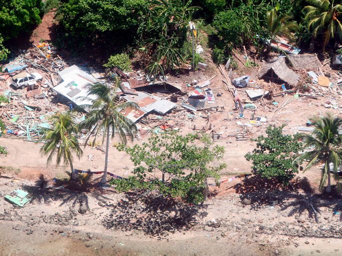 epa00976357 Aerial view of houses destroyed by Monday's earthquake and subsequent tsunami in the Gizo island, Thursday 5 April 2007. The western island of Gizo and surrounding villages were badly hurt by the tidal wave and the emergency supplies start to arrive as the Gizo airport reopened today. EPA/FRANCK ROBICHON