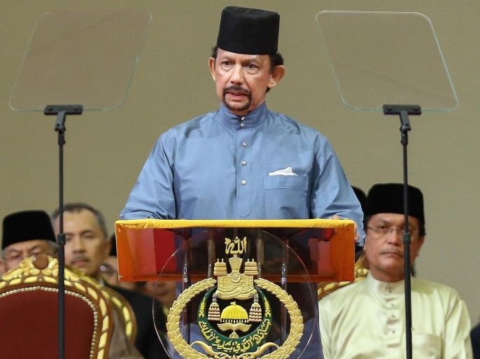 Brunei's Sultan Hassanal Bolkiah delivers a speech during the official ceremony of the implementation of Sharia Law in Bandar Seri Begawan on April 30, 2014. The Sultan of Brunei announced on April 30 that a controversial new penal code featuring tough Islamic criminal punishments would be phased in beginning on May 1. AFP PHOTO