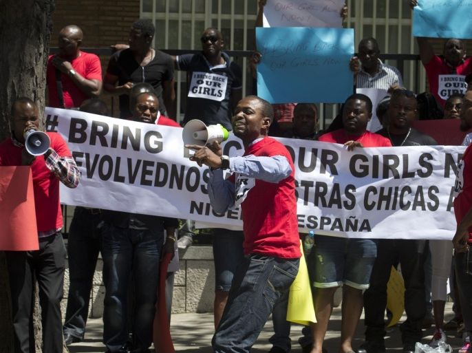 Nigerians resident in Spain protest outside the Nigerian embassy in Madrid, Spain, Friday, May 16, 2014 in support of the kidnapped school girls in Abuja, Nigeria. Boko Haram insurgents on April 15 abducted more than 300 students from the Chibok Government Girls Secondary School. Police say 53 managed to escape and 276 remain in captivity. Banner reads 'Bring Back Our Girls' in Spanish and English. (AP Photo/Paul White)
