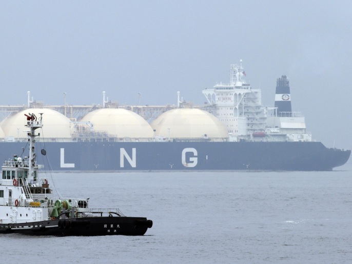 Liberian LNG tanker Al Hamra arrives at a port in Yokohama, southwest of Tokyo, Monday, April 21, 2014. Japan's trade deficit surged nearly 70 percent to a record 13.75 trillion yen ($134 billion) in the last fiscal year as exports failed to keep pace with surging costs for imported oil and gas. (AP Photo/Koji Sasahara)
