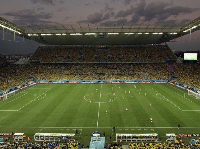 The group A World Cup soccer match between Brazil and Croatia, the opening game of the tournament, in the Itaquerao Stadium is played on the field during sunset, Thursday, June 12, 2014, in Sao Paulo, Brazil. (AP Photo/Shuji Kajiyama)