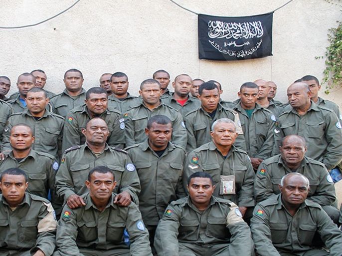 This undated image attached in a statement released on Saturday, Aug. 30, 2014 on the Hanin Network website, a militant website, shows Fijian UN peacekeepers who were seized by The Nusra Front on Thursday in the Golan Heights in the buffer zone between Syria and Israel. Al-Qaida-linked Syrian rebels holding 45 Fijian peacekeepers hostage have issued a set of demands for their release, including the extremist group's removal from a U.N. terrorist list and compensation for the killing of three of its fighters in a shootout with international troops, an official said Tuesday. (AP Photo/Hanin Network Website)