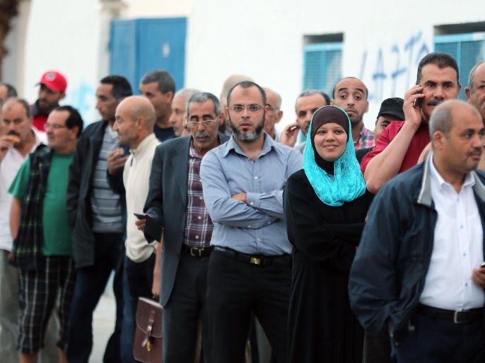 Tunisians men line up to vote at a polling station during the Tunisian parliamentary elections in Tunis, Tunisia, 26 October 2014. Tunisians vote in the parliamentary elections that is a major step in the North African country's democratic transition following the 2011 ouster of longtime autocrat Zine Abidine Ben Ali. Tunisian authorities have stepped up security in the run-up to the vote for fear of attacks by Islamist militants.