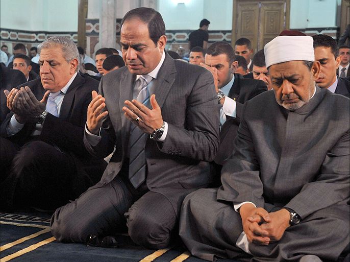 A handout picture released by the Egyptian Presidency shows Egypt's President Abdel Fattah al-Sisi (C), along with Grand Imam of al-Azhar Shiekh Ahmed el-Tayeb (R) and Prime Minister Ibrahim Mahlab (L), performing prayers on the Muslim holiday of Eid al-Adha, or feast of sacrifice, in the capital Cairo on October 4, 2014. The religious festival, celebrated by a total of about 1.5 billion Muslims around the world in remembrance of Abraham's readiness to sacrifice his son to God, marks the end of the annual pilgrimage to Mecca. AFP PHOTO / HO /EGYPTIAN PRESIDENCY