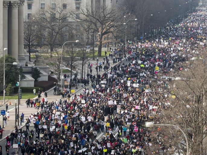 Thousands take part in the Justice for All March and Rally on Pennsylvania Avenue to the US Capitol in Washington, DC, on December 13, 2014, to protest the killings of unarmed African-Americans by police officers and the decisions by Grand Juries to not indict them. AFP PHOTO / SAUL LOEB