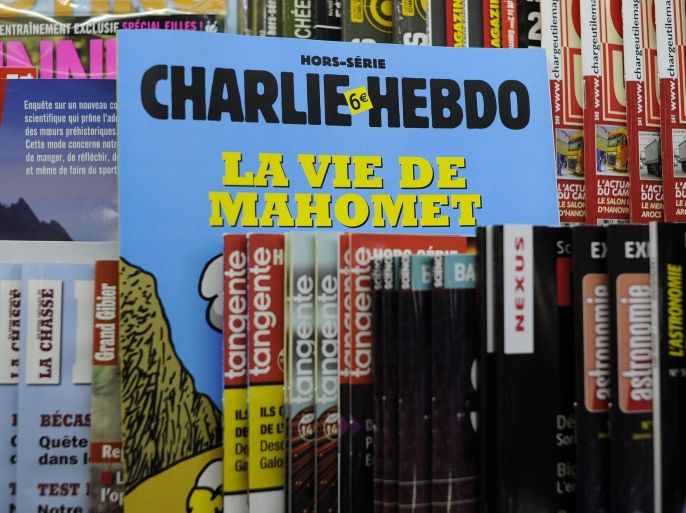 (FILE) A file picture dated 02 January 2013 shows a special edition of the French satirical magazine Charlie Hebdo between other publications in Paris, France. According to news reports on 07 January 2015, several people have been killed in a shooting attack at satirical French magazine Charlie Hebdo in Paris. EPA/YOAN VALAT *** Local Caption *** 50648492