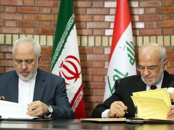 Iranian Foreign Minister Mohammad Javad Zarif (L) attends a press conference with Iraqi Foreign Minister Ibrahim al-Jaafari in the Iraqi capital Baghdad on February 24, 2015. AFP PHOTO / SABAH ARAR