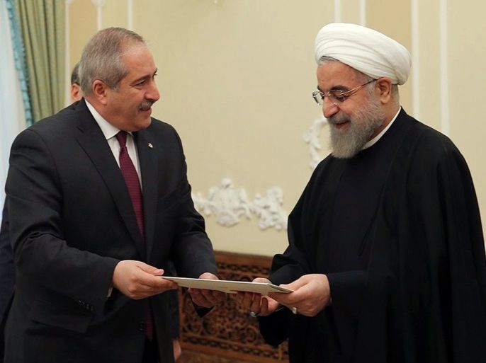 AK002 - Tehran, -, IRAN : A handout picture released by the official website of the Iranian President Hassan Rouhani shows him (R) meeting with Jordanian Foreign Minister Nasser Judeh on March 7, 2015 in the capital Tehran. Judeh is on an official visit to Iran. AFP PHOTO / HO / IRANIAN PRESIDENCY WEBSITE