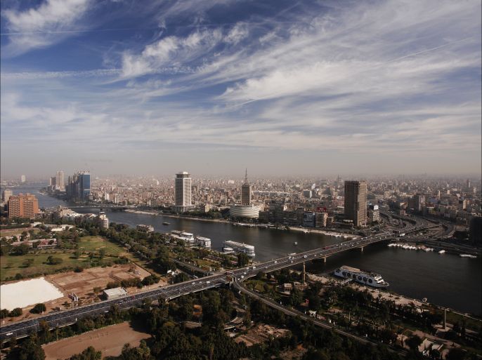 epa04480502 A general view of the 6 October Bridge traversing River Nile from Gezira Island (foreground) to Cairo City Center (background), Cairo, Egypt, 07 November 2014. The buildings are: the Ministry of Foreign Affairs (C-L), the Maspero Television building housing the Egyptian Radio and TV Union (C) and the Ramses Hilton Hotel (C-R). EPA/BEN WENZ