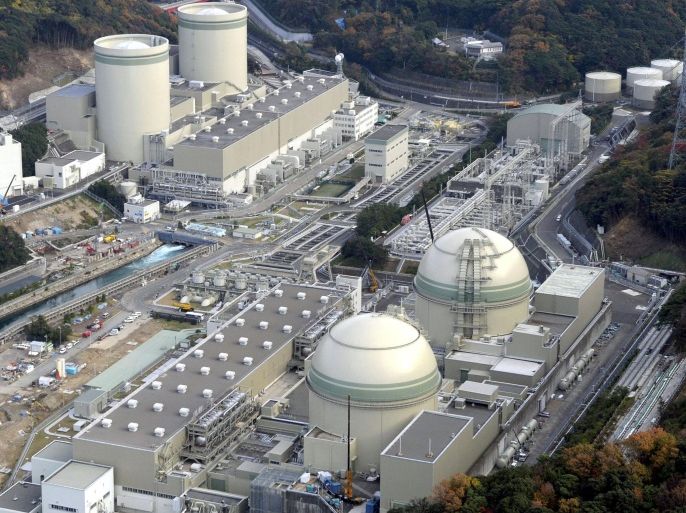 An aerial view shows No. 4 (front L), No. 3 (front R), No. 2 (rear L) and No. 1 reactor buildings at Kansai Electric Power Co.'s Takahama nuclear power plant in Takahama town, Fukui prefecture, in this photo taken by Kyodo November 27, 2014. A Japanese court on Tuesday issued an injunction to prevent the restart of two reactors citing safety concerns, in a blow to Prime Minister Shinzo Abe's push to return to atomic energy four years after the Fukushima crisis. Picture taken November 27, 2014. Mandatory credit. REUTERS/Kyodo ATTENTION EDITORS - THIS IMAGE WAS PROVIDED BY A THIRD PARTY. THIS PICTURE IS DISTRIBUTED EXACTLY AS RECEIVED BY REUTERS, AS A SERVICE TO CLIENTS. FOR EDITORIAL USE ONLY. NOT FOR SALE FOR MARKETING OR ADVERTISING CAMPAIGNS. MANDATORY CREDIT. JAPAN OUT. NO COMMERCIAL OR EDITORIAL SALES IN JAPAN.