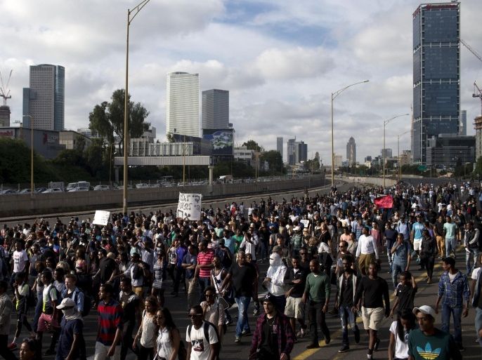 Israel's Jewish Ethiopians block highway during a protest against racism and police brutality in Tel Aviv, Israel, Sunday, May 3, 2015. Several thousand people, mostly from Israel's Jewish Ethiopian minority, protested in Tel Aviv against racism and police brutality on Sunday shutting down a major highway and scuffling with police. (AP Photo/Oded Balilty)