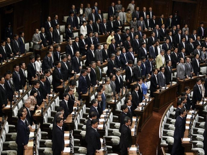 Majority lawmakers stand up for a vote during a House of Representatives plenary session on the controversial security bills at the parliament in Tokyo, Japan, 16 July 2015. Japan's powerful lower house approved legislation to allow the nation's military to make greater use of its forces abroad, despite growing public opposition. The bills passed with a majority vote by Prime Minister Shinzo Abe's Liberal Democratic Party and its coalition partner Komeito. The main opposition Democratic Party of Japan and four other parties boycotted the vote.