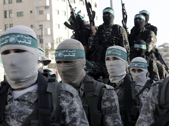 A picture made available on 27 August 2015 shows Palestinian fighters of the Izz ad-Din al-Qassam Brigades, the military wing of the Palestinian Hamas organization, taking part in a parade in Al Meena square in the west of Gaza City, Gaza Strip, 26 August 2015. The militants paraded demanding Israel to implement the cease-fire after the Israeli-Hamas conflict in the summer of 2014.