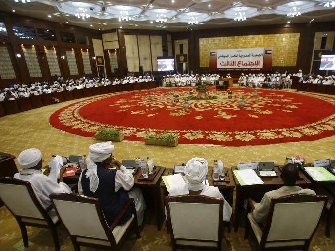 Members of the general assembly for the national dialogue, chaired Sudanese President Omar al-Bashir, attend a session on August 20, 2015 in the capital Khartoum. Bashir said he was ready for a two-month ceasefire with rebels in Sudan's border regions to allow national dialogue talks to take place to address the country's myriad problems, offering insurgents an amnesty. AFP PHOTO/ ASHRAF SHAZLY