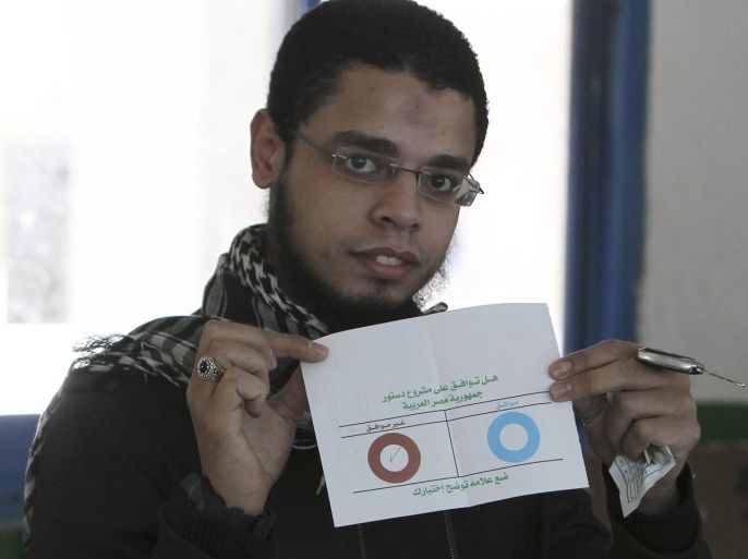 An Egyptian man shows his ballot paper reading no, before casting it, during the second round of a referendum for the new Egyptian constitution, at a polling in Giza, Cairo, Egypt, 22 December 2012. More than 25 million eligible Egyptians were called to cast their ballots 22 December in the final phase of a referendum on a disputed draft constitution that has sparked demonstrations by pro- and anti-government protesters. Voting was taking place in 17 electoral districts that are considered to be broadly conservative, meaning a yes vote is expected to prevail.