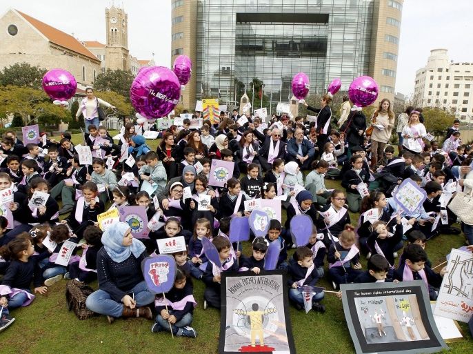 Lebanese and Palestinian school children carry placards during a protest on the occasion of the Human Rights Day in front the UN house in down town Beirut, Lebanon, 10 December 2014. The UN General Assembly declared 10 December as Human Rights Day in 1950, to bring to the attention the Universal Declaration of Human Rights as the common standard of achievement for all peoples and all nations.