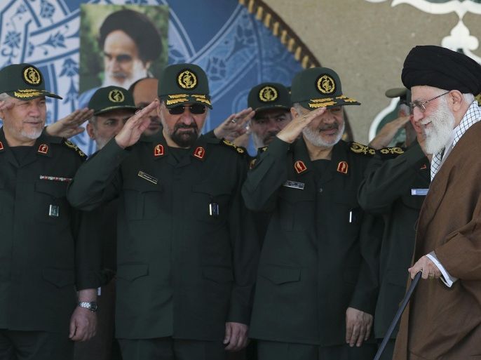 In this picture released by an official website of the office of the Iranian supreme leader on Wednesday, May 20, 2015, Supreme Leader Ayatollah Ali Khamenei, right, arrives at a graduation ceremony of the Revolutionary Guard's officers, while deputy commander of the Revolutionary Guard, Hossein Salami, second right, former commanders of the Revolutionary Guard Mohsen Rezaei, second left, and Yahya Rahim Safavi salute him in Tehran, Iran. Iran's supreme leader vowed Wednesday he will not allow international inspection of Iran's military sites or access to Iranian scientists under any nuclear agreement with world powers. (Office of the Iranian Supreme Leader via AP)