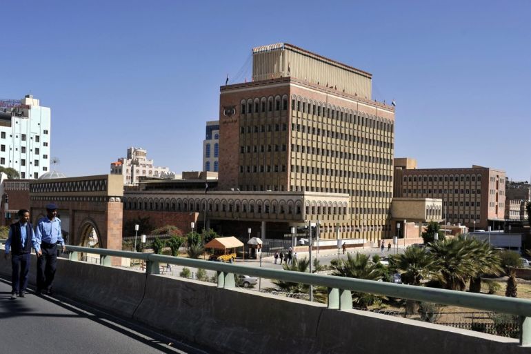 A picture made available on 29 November 2014 shows two Yemeni policemen patrolling on a bridge in front of the headquarters of the Central Bank of Yemen, in Sana'a, Yemen, on 04 November 2014. According to figures released by the Central Bank of Yemen, the country's external debt stood at 7.25 billion US dollar in September 2014, down some 128 million US dollar from last August. The Central Bank of Yemen reported also that international financing organizations make up the largest creditors with collective loans worth 3.6 billion US dollar.