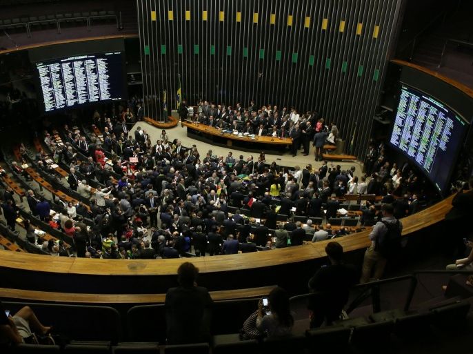 The Chamber of Deputies meets to vote on whether or not to impeachment Brazil's President Dilma Rousseff in Brasilia, Brazil, Sunday, April 17, 2016. The vote will determine whether the impeachment proceeds to the Senate. Rousseff is accused of violating Brazil's fiscal laws to shore up public support amid a flagging economy. (AP Photo/Eraldo Peres)