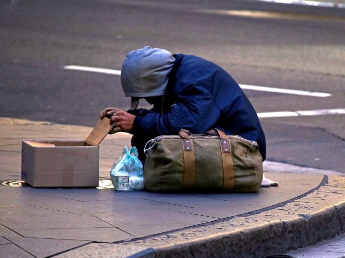 A man claiming to be homeless begs for money on a street corner in central Sydney, Australia July 2, 2016. Picture taken July 2, 2016. REUTERS/David Gray