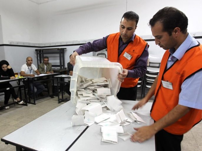 Election officials count votes in the municipal elections in the West Bank city of Hebron, 20 October 2012. The last time local elections were held in the West Bank and Gaza Strip was in December 2005 and the last presidential and legislative elections were held early in 2006.