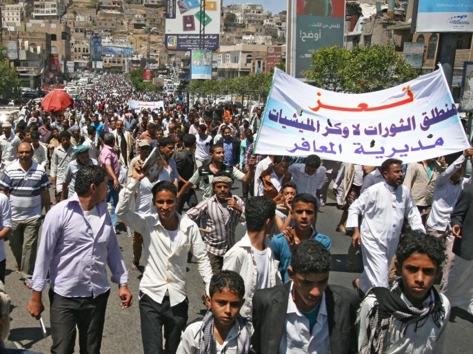 Yemeni protesters hold a banner reading 'Taiz is home of revolutions, not a den of militias' during a protest against the Houthi takeover of several state facilities in the central city of Taiz, Yemen, 22 March 2015. Yemen's Shiite Houthi rebels swept into the strategic central city of Taiz, capturing several state facilities in the city including the city's airport, airbase and a court complex.