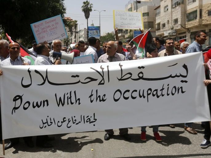 Palestinians carry Palestinian flags, banners and placards during a protest rally to mark the 49th anniversary of what they call 'Naksa Day', in the West Bank city of Hebron, 05 June 2016. Naksa is the anniversary of the outbreak of the so-called 'Six Day War' in 1967 which resulted in the Israeli occupation of East Jerusalem, the West Bank, the Gaza Strip, the Syrian Golan hights and all of the Sinai peninsula.