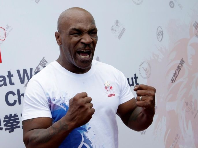 Former boxer Mike Tyson reacts as he speaks to the media, before the weigh-in of International Boxing Federation (IBF) World Championship Bout at the Mutianyu section of the Great Wall of China, on the outskirts of Beijing, China, May 24, 2016. REUTERS/Jason Lee