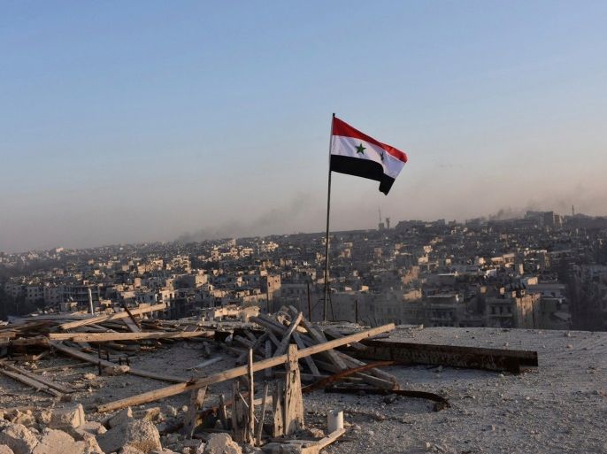 A Syrian national flag flutters near a general view of eastern Aleppo after Syrian government soldiers took control of al-Sakhour neigbourhood in Aleppo, Syria in this handout picture provided by SANA on November 28, 2016. SANA/Handout via REUTERS ATTENTION EDITORS - THIS IMAGE WAS PROVIDED BY A THIRD PARTY. EDITORIAL USE ONLY. REUTERS IS UNABLE TO INDEPENDENTLY VERIFY THIS IMAGE.