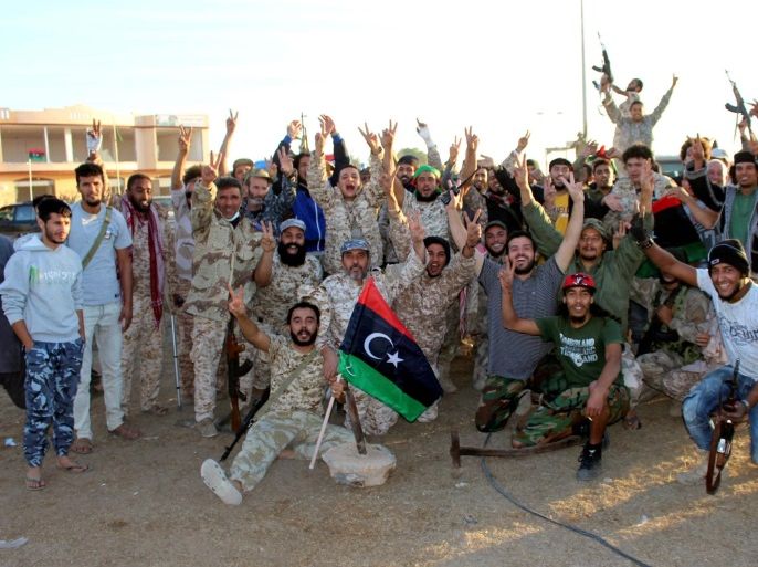 Fighters of Libyan forces allied with the U.N.-backed government celebrate as they are close to securing last Islamic State holdouts in Sirte, Libya December 5, 2016. Picture taken December 5, 2016. REUTERS/Ayman Sahely EDITORIAL USE ONLY. NO RESALES. NO ARCHIVE.