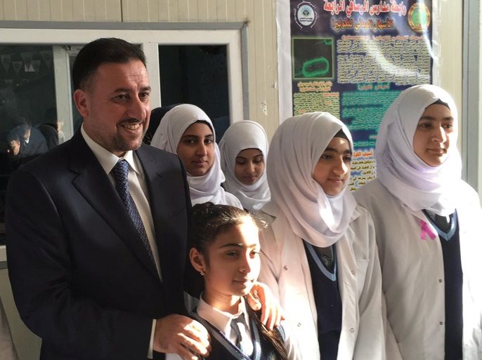 Khamis Khanjar, (L) a Sunni multimillionaire, visits displaced Sunni Iraqis at a school he funds in Iraqi Kurdistan, Iraq, February 16, 2016. REUTERS/Ned Parker