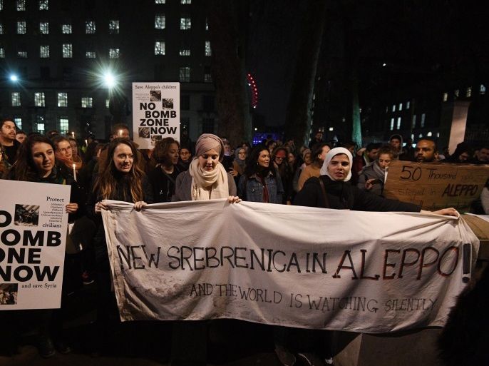 Protesters with banners ' No bomb zone now' and ' New Srebrenica in Aleppo' gather during a demonstration calling to stop the bombing of Aleppo in Syria outside 10 Downing street in London, Britain, 13 December 2016. Protesters gathered to urge the international community to support civilians in Aleppo, and against Russian airstrikes. The Syrian army announced that it already controlled 98 percent of eastern Aleppo, after a wide-scale military offensive that began on 15 November and had since left over 1,000 people killed.