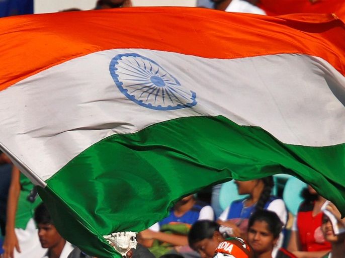 Cricket - India v England - Second Test cricket match - Dr. Y.S. Rajasekhara Reddy ACA-VDCA Cricket Stadium, Visakhapatnam, India - 19/11/16. A fan waves an Indian flag during the match. REUTERS/Danish Siddiqui