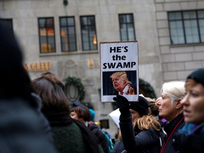 Protestors march during a demonstration against U.S. President-elect Donald Trump near Trump Tower in the Manhattan borough of New York City, December 12, 2016. REUTERS/Shannon Stapleton