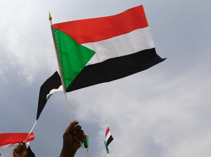 Supporters carry images of Sudan's President Omar al-Bashir and flags during a rally against the International Criminal Court (ICC), at Khartoum Airport in Sudan, July 30, 2016. REUTERS/Mohamed Nureldin Abdallah