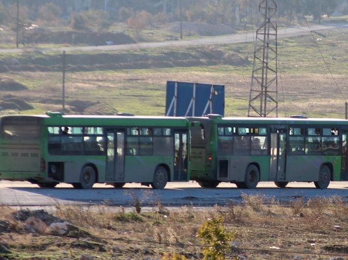 Syrian government green buses carry fighters and their families during evacuation from rebel-held zones in Aleppo, Syria, 15 December 2016. The evacuation of Aleppo began on 15 December as the first ambulances and buses extracted the sick and wounded from final rebel-held zones in the northern Syrian city, the Red Cross NGO said. Reports state the first batch of 951 gunmen and their families were evacuated via al-Ramouseh crossing to Aleppo southwestern countryside.