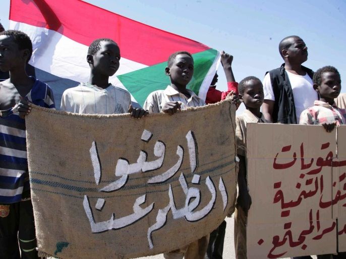 Young Sudanese children hold a banner reading in Arabic 'Lift the injustice' during a protest against longstanding US sanctions on Sudan, outside the US embassy, Khartoum, Sudan, 03 November 2015. The US imposed economic and trade sanctions on the country 1997, in response to allegations of harbouring terror groups and human rights abuses against the regime of Omar al-Bashir.