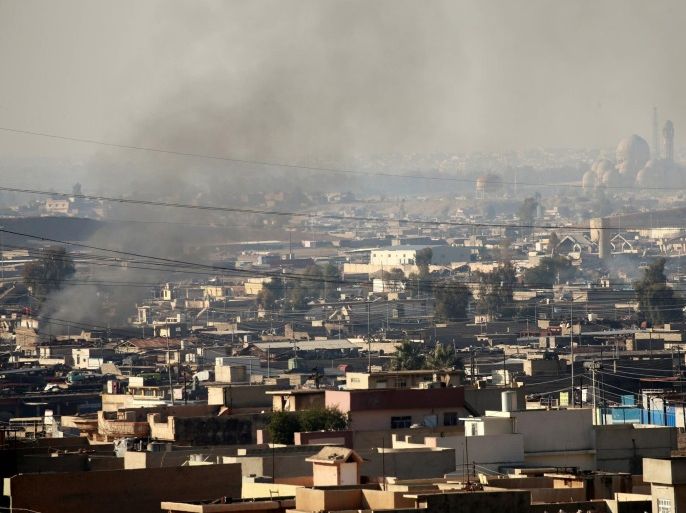 Smoke rises from clashes during a battle with Islamic State militants in the Mithaq district of eastern Mosul, Iraq, January 3, 2017. REUTERS/Thaier Al-Sudani