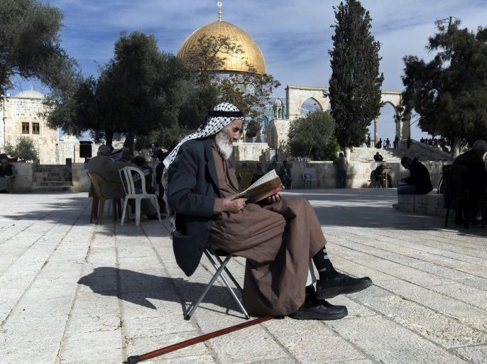 (FILE) The file picture dated 13 November 2014 shows the Dome of the Rock behind a Palestinian reading the Koran on a plaza in the al-Aqsa Mosque compound, or Temple Mount in Jerusalem, Israel. Following a Palestinian initiative, an UNESCO formal decision on 13 October 2016 denies a Jewish link to the Temple Mount and the Western Wall. Twenty-four countries supported the resolution, six voted against it and 26 members abstained.