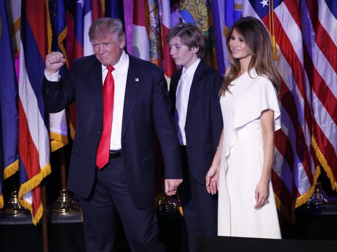 YEARENDER 2016 NOVEMBERUS Republican presidential nominee Donald Trump (L) gestures next to his son Barron (C) and his wife Melania Trump (R) as he delivers a speech on stage at Donald Trump's 2016 US presidential Election Night event as votes continue to be counted at the New York Hilton Midtown in New York, New York, USA, 08 November 2016.