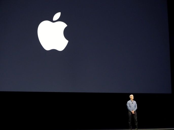 Apple Inc. CEO Tim Cook leads a moment of silence for the victims of the attack in Orlando as he opens the company's World Wide Developers Conference in San Francisco, California June 13, 2016. REUTERS/Stephen Lam