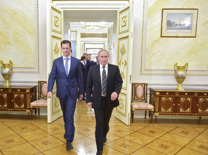 Russian President Vladimir Putin (R) and Syrian President Bashar al-Assad enter a hall during a meeting at the Kremlin in Moscow, Russia, October 20, 2015. To match INSIGHT MIDEAST-CRISIS/SYRIA-ALEPPO-FALL Alexei Druzhinin/RIA Novosti/Kremlin/via REUTERS/File Photo ATTENTION EDITORS - THIS IMAGE HAS BEEN SUPPLIED BY A THIRD PARTY.