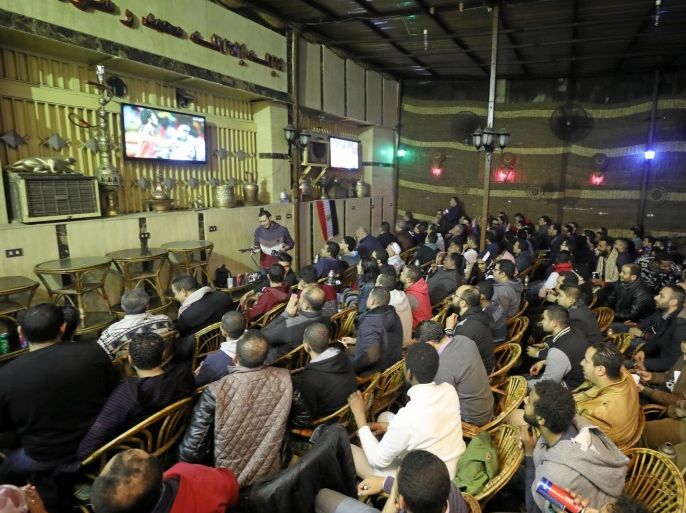 Egyptians watch the final match of the 2017 African Nations Cup, taking place in Gabon, between their national team and Cameroon, at a cafe in the capital Cairo, Egypt, February 5, 2017. REUTERS / Mohamed Abd El Ghany