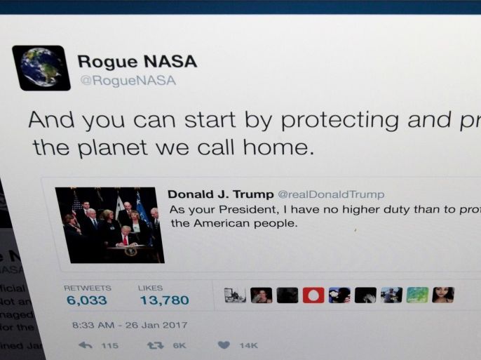 The Twitter account of Rogue NASA is seen replying to a tweet by U.S. President Donald Trump in a photo illustration in Toronto, Ontario, Canada January 26, 2017. REUTERS/Chris Helgren