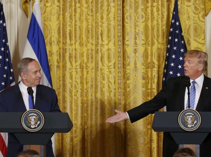 U.S. President Donald Trump (R) acknowledges Israeli Prime Minister Benjamin Netanyahu at a joint news conference at the White House in Washington, U.S., February 15, 2017. REUTERS/Kevin Lamarque